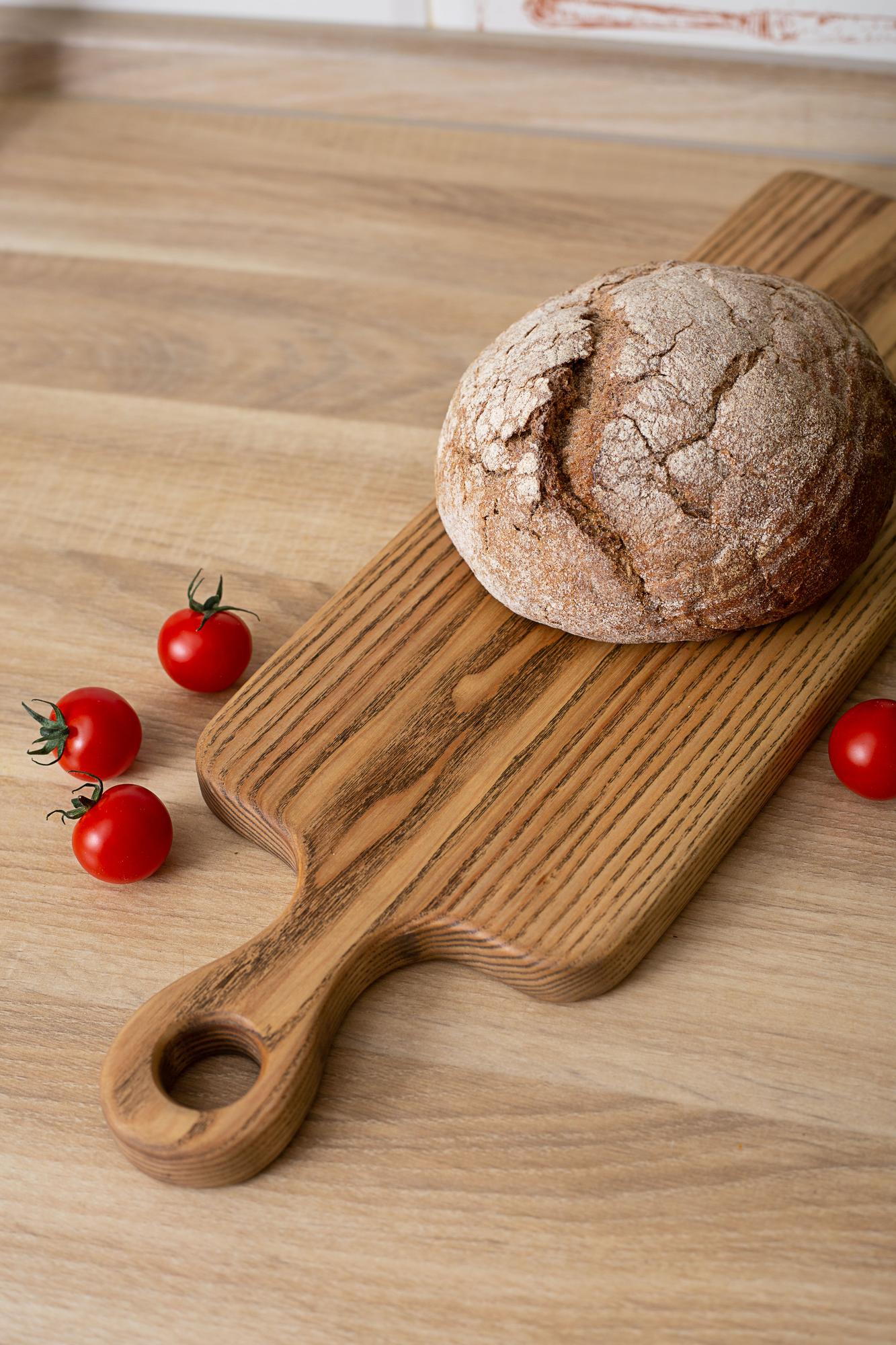 Artisan bread sliced on board with linen