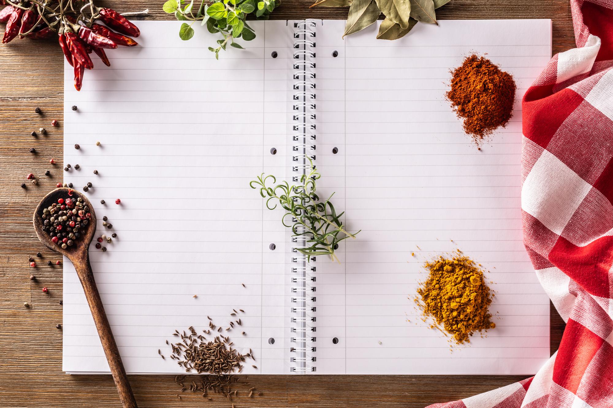 Flat lay of meal planning notebook and spices